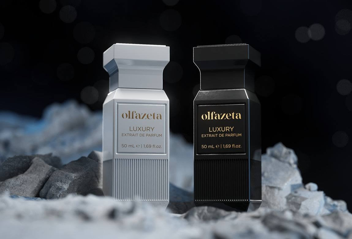 Zwei Olfazeta Extrait de Parfum Flakons in luxuriösem Design vor dunklem Hintergrund.